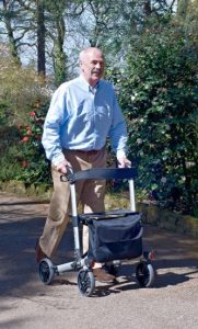 elderly gentleman using 4 wheel walker